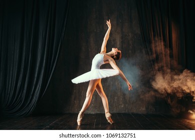 Ballerina In White Dress Dancing In Ballet Class