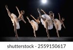 Ballerinas performing under dramatic spotlight, creating striking visual of elegance and movement on stage during classical ballet dance. Concept of classical dance, art, beauty of movements