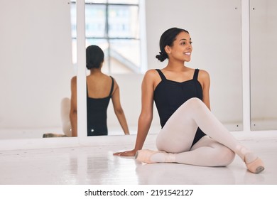 Ballet, ballerina and dancer sitting on floor during break and rest from dancing beautiful, elegant or classical choreography. Smiling professional performer in dance studio after practicing routine - Shutterstock ID 2191542127