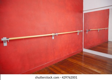 Ballet Bar Against Red Wall In Studio