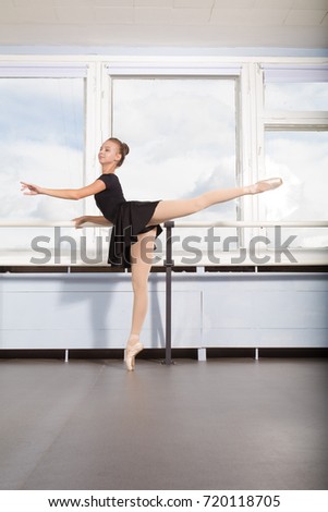 Ballet class, girl ballerina doing exercises