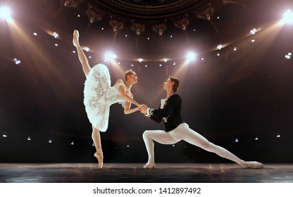 Ballet. Classical ballet performed by a couple of ballet dancers on the stage of the opera house.