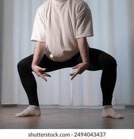 Ballet dance pose Dance poses in the studio. Male dancer warms up during training. - Powered by Shutterstock