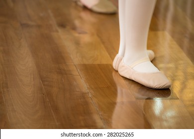 Ballet Dancer Feet On Wooden Floor