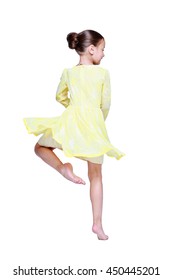 Ballet Dancer Girl In Yellow Casual Dress Barefoot Isolated On White, Little Ballerina Is Spinning On One Leg. Education Lessons In Classic, Salsa And Latin Dance School