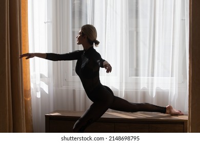 Ballet Dancer. Home Workout. Young Female Woman Workout, Fitness Training At Home Near Window. Girl Stretching Fit Body.