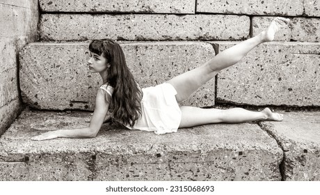 Ballet Dancer on Stone Steps - Powered by Shutterstock