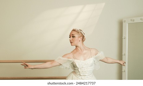 Ballet Dancer Practicing at Barre with Dramatic Lighting