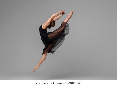 Ballet Dancer Woman Black Dress On Gray Background