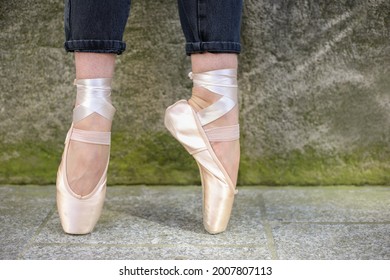 Ballet Dancer's Legs In Ballet Shoes Outdoors