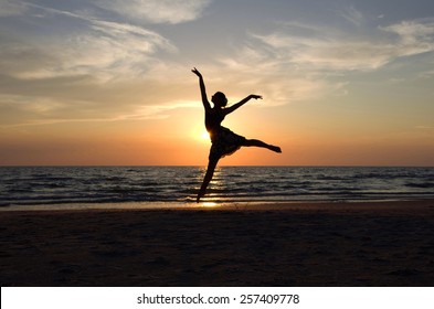 Ballet dancer's silhouette by the Sea in Sunset light
