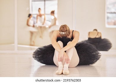 Ballet, depression and sad ballerina girl after theatre practice, dance rehearsal or performance in a dancing hall or studio. Tired, bullying and stress of professional dancer sitting crying on - Powered by Shutterstock