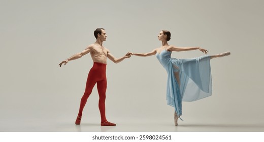 Ballet duet creating dynamic diagonal, one reaching outward, other arching in balance, flowing fabric accentuating movement against white background. Concept of motion, connection, aesthetics.