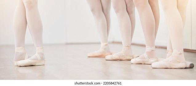 Ballet, Leader And Dancer Group Feet In Dance Studio Training In Artist Academy With White Wall And Floor. Women Team, Class Or Students Dancing On Pointe Shoes For School Performance With Lens Flare