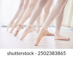 Ballet, point shoes and feet on floor in dancing, artist and professional ballerina studio for exercise. Workout, break and performance training with legs of women in group for fitness at class