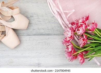 ballet, pointe shoes, tutu and bouquet of flowers. Top view