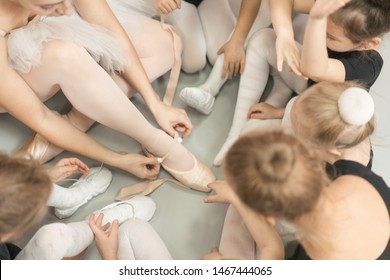 Ballet School Teacher Shows Pointe Shoes To The Lesson