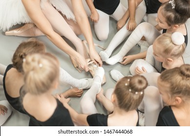 Ballet School Teacher Shows Pointe Shoes To The Lesson