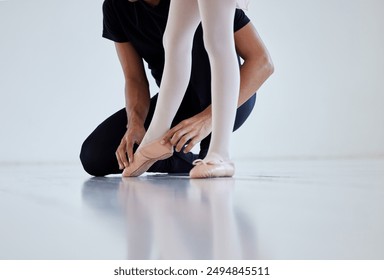 Ballet, student and teacher for training feet for position, correct posture and alignment for technique. Male mentor, girl and ballerina for instruction for dance coaching, performance and practice. - Powered by Shutterstock