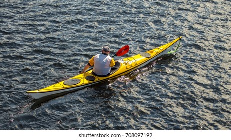 Balloch, Loch Lomond, Scotland; 26 August 2017: The Great Swim Event On Loch Lomond. Safety Person In A Bright Yellow Kayak