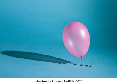 The Balloon Is About To Burst From The Sharp Button.