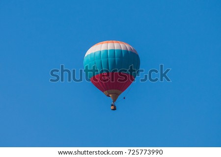 balloon in the blue sky in the color of the Russian flag