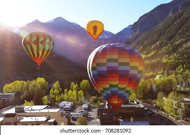 Balloon Festival In Telluride Hot Air Balloons Flying Over Town In The Morning Sunrise ,Telluride, Colorado, USA, 06.01.2013