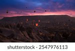 Balloon flight at sunrise in Cappadocia.  The colorful hot air balloon tour begins. Turkey