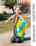 Balloon man dolly in the summer sun on the school garden