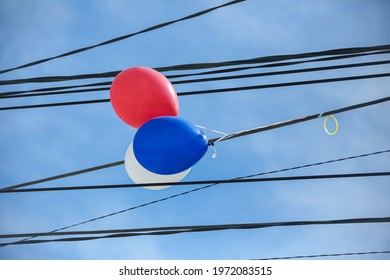 Balloon In Power Lines Against The Sky