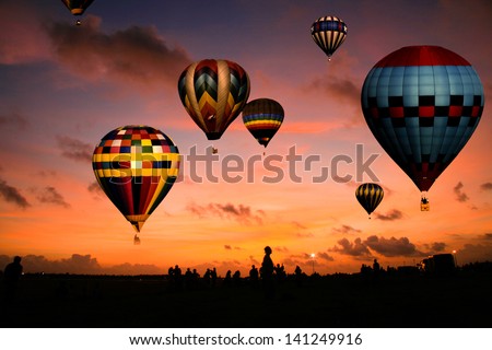 A balloon race at sunrise.