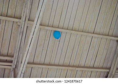 the balloon at the white ceiling is stuck and does not fly away