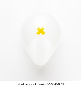 Balloon With Yellow Cross On It Over White Background. Not Isolated