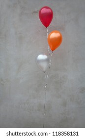 balloons before the wall
