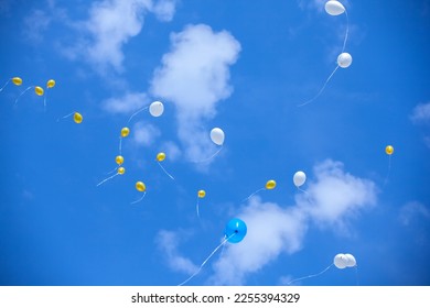 Balloons in the blue sky - Shutterstock ID 2255394329