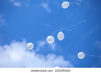 Balloons in the blue sky - Shutterstock ID 2255394331