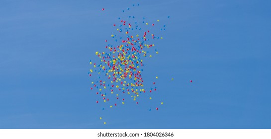 Balloons in the colors of the Romanian flag floating on National Day - Powered by Shutterstock