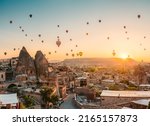 balloons at fairy chimneys at sunrise in Göreme, Cappadocia