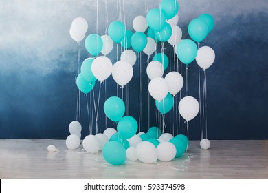 Balloons On Dark Blue Wall Background. Colorful Balloons In Room Prepared For Birthday Party.