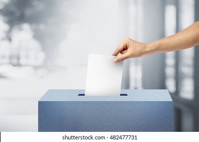 Ballot box with person vote on blank voting slip voting concept. - Shutterstock ID 482477731