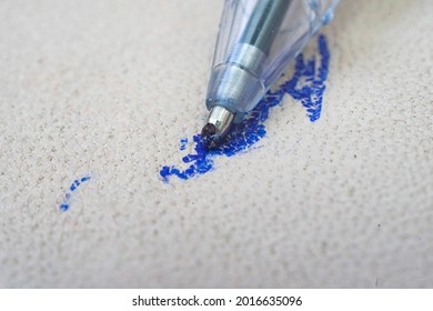 Ballpoint pen tip, scribbling on a white leather sofa, or car seats. - Shutterstock ID 2016635096