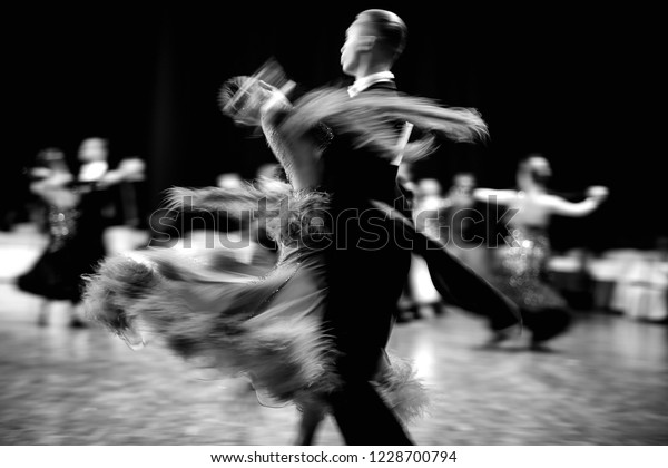 ballroom dance couple dancers waltz\
blurred motion\
black-and-white