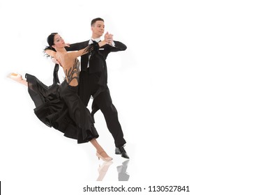 ballroom dance couple in a dance pose isolated on white background. ballroom sensual proffessional dancers dancing walz, tango, slowfox and quickstep ballroom couple dance professional