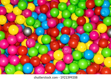 Balls for dry pool. Full frame of multicolored plastic balls in the ball pit (ball crawl).Dry Swimming pool for fun and jumping in colored plastic balls. The concept of celebration and fun.game room