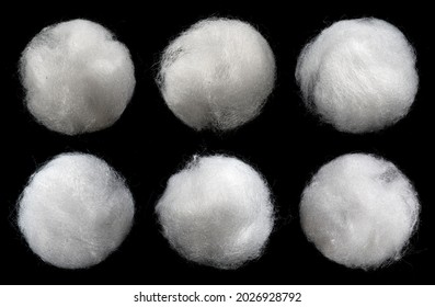 Balls of fluffy cotton wool isolated on black background