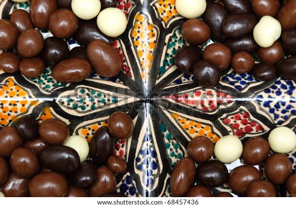 Ball-shaped\
chocolates in a tray divided into four\
parts