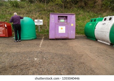 Ballymena, Northern Ireland, March 2019, A man attending to Ballymena recycling centre where there is a sign reading, no dumping.