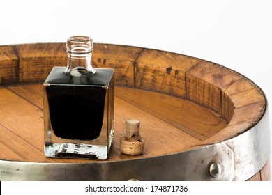 Balsamic Vinegar Bottle Isolated With A Barrel