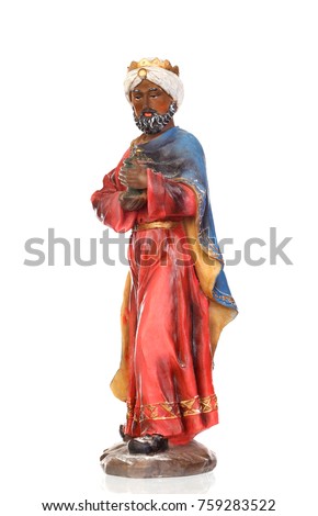 Baltasar, one of the three wise men. Ceramic figure isolated on white background