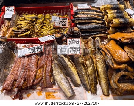 Baltic fish taste expressed in assorted smoked fish in riga central market, showing popular latvian flavors and ready to eat seafood, for culinary and regional food concepts